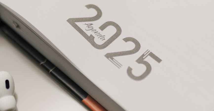 modern planner with headphones and pen